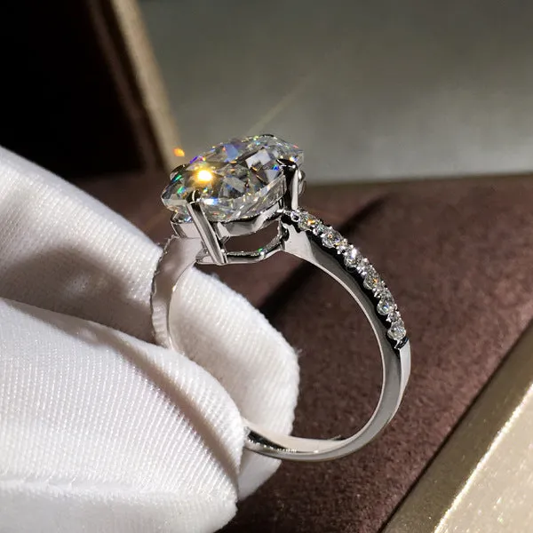 Women's moissanite four-prong princess cut ring in white gold colour on copper band, size no.7