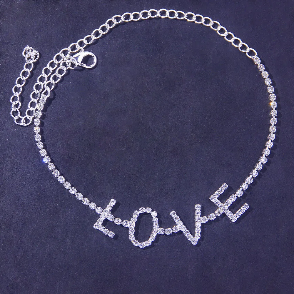 Gold letter anklet spelling LOVE with clear rhinestones on copper chain