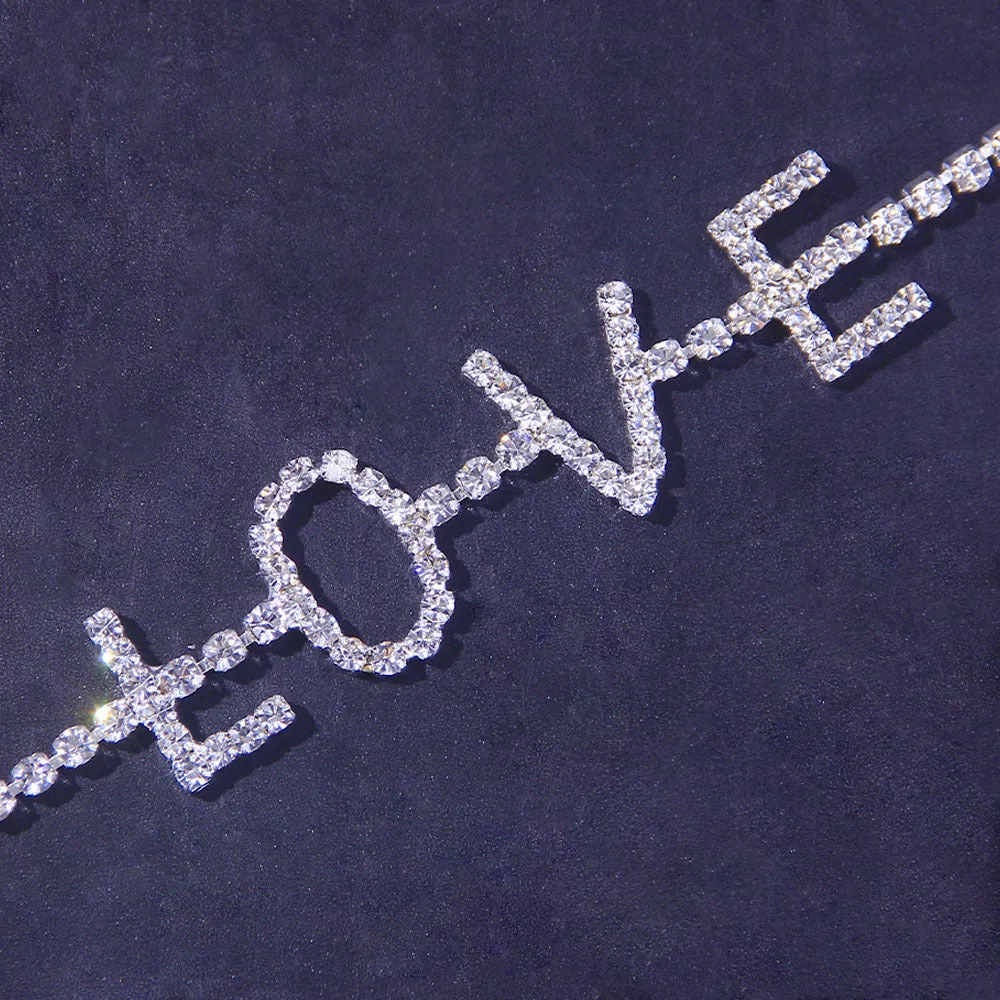 Gold letter anklet spelling LOVE with clear rhinestones on copper chain