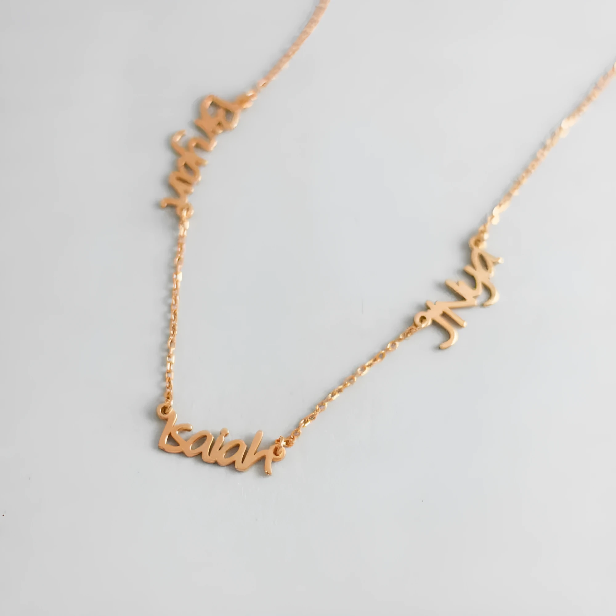 Custom stainless steel name necklace with gold plating, 4x1cm pendant on 40cm O-chain, personalised with three names
