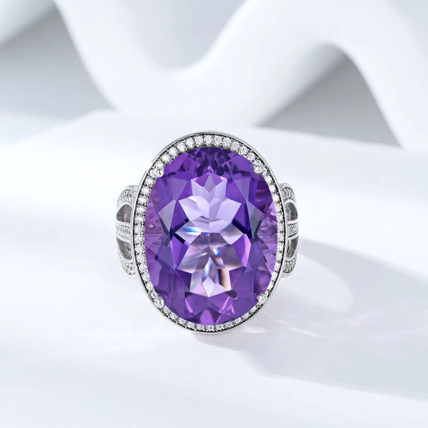 Natural amethyst ring in 925 silver with oval 19-carat stone, white finish, side view on finger