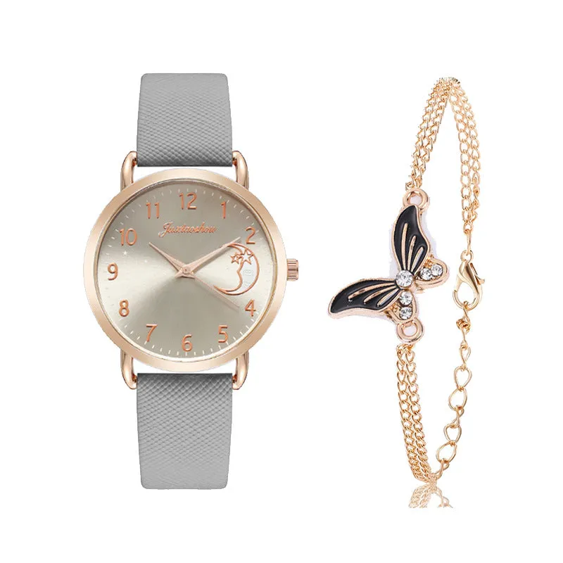 Women's quartz watch with round dial, imitation leather strap, and rose gold pin buckle on a white background.