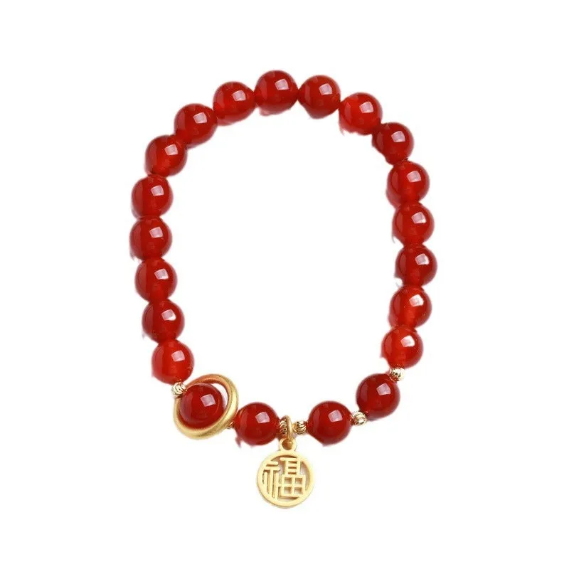 Natural red agate bracelet with woven bead design on a wrist.