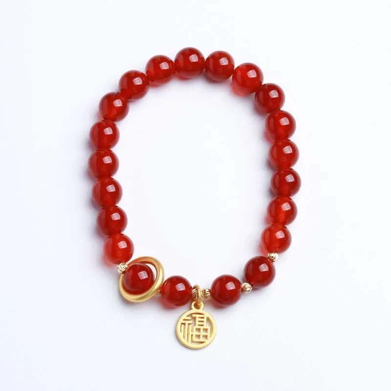 Natural red agate bracelet with woven bead design on a wrist.