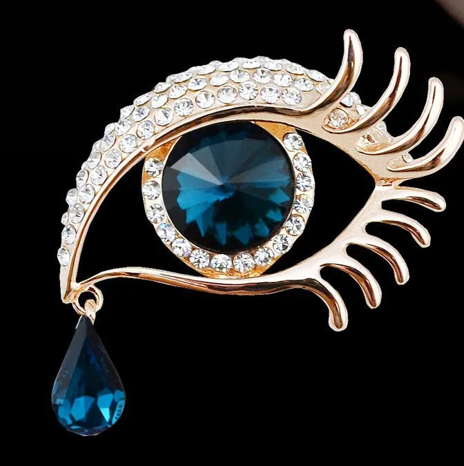 Teardrop rhinestone brooch pin alloy gold electroplated unisex totem style