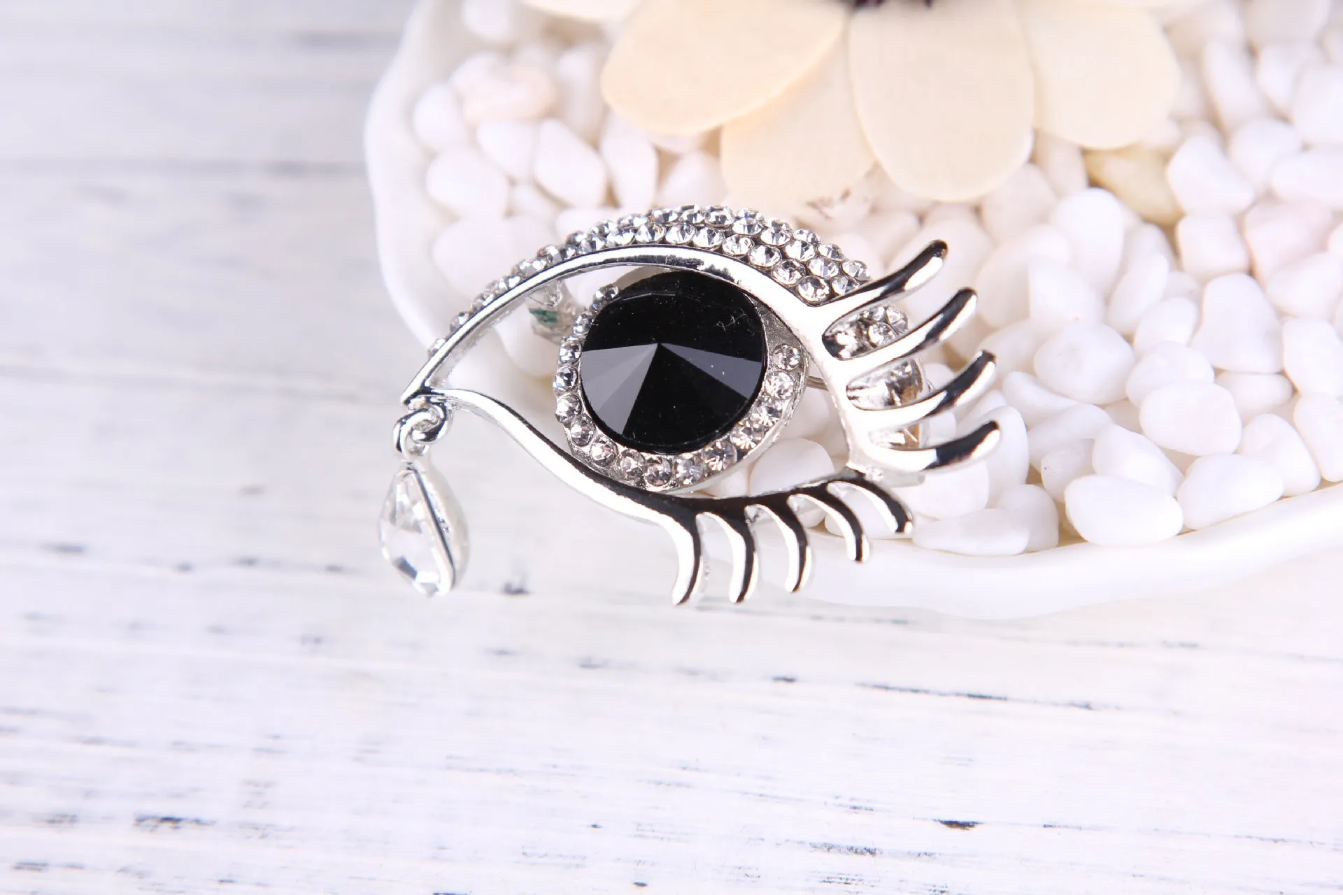 Teardrop rhinestone brooch pin alloy gold electroplated unisex totem style