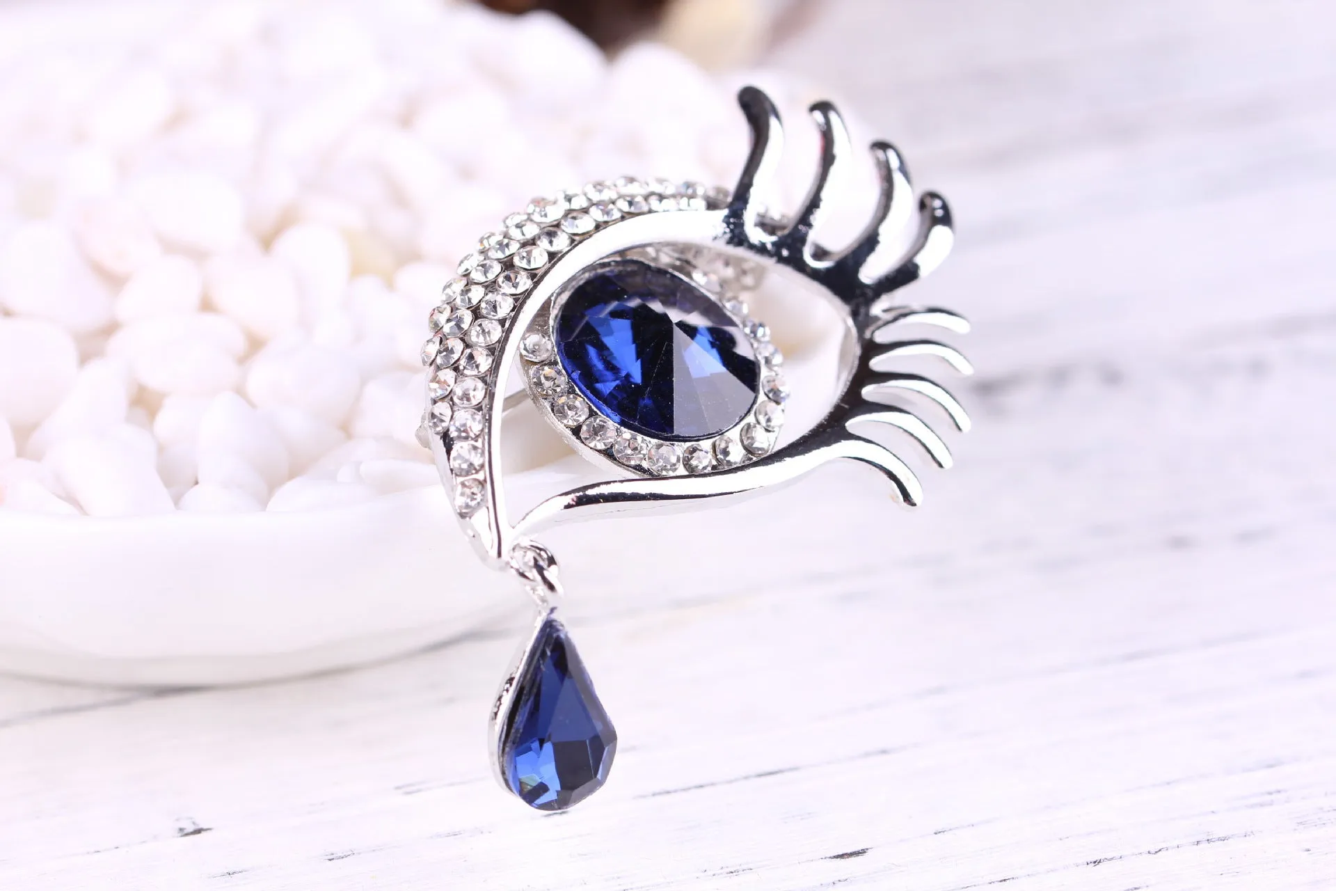 Teardrop rhinestone brooch pin alloy gold electroplated unisex totem style