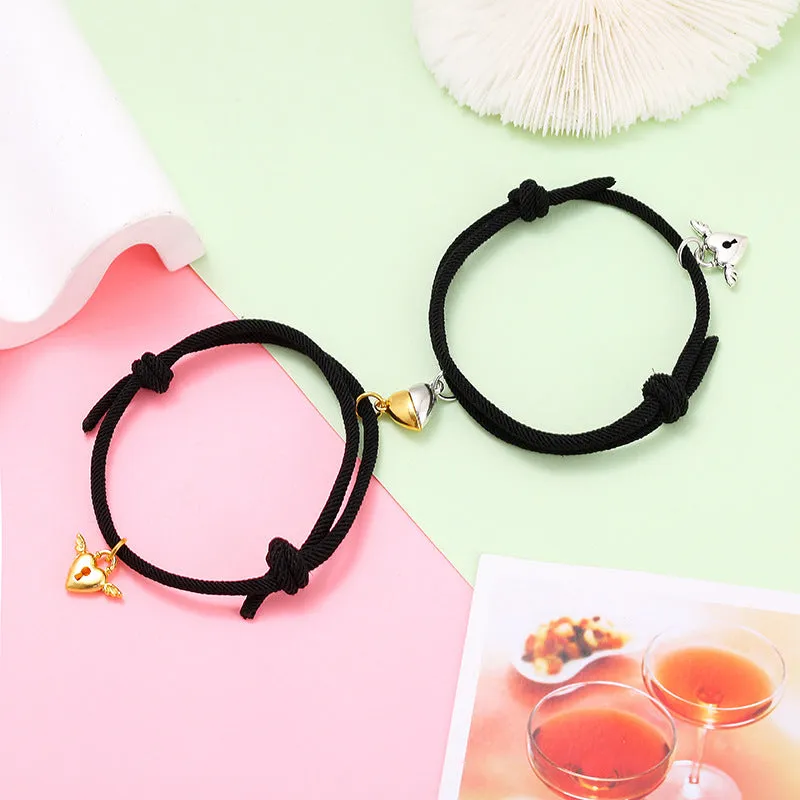 New Love Magnet couple bracelet set, heart-shaped alloy design in black and white, matching pair