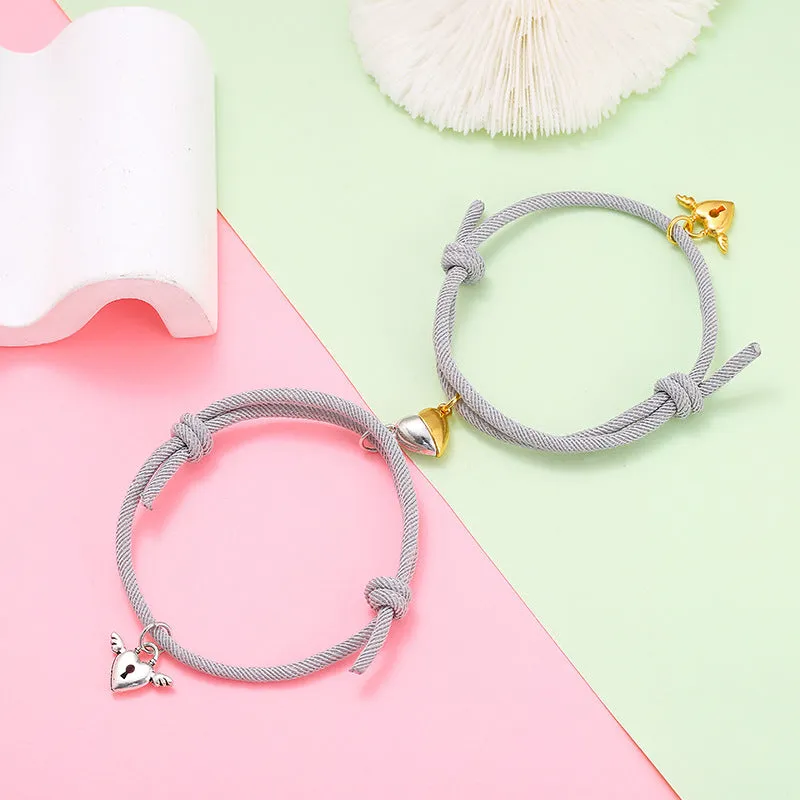 New Love Magnet couple bracelet set, heart-shaped alloy design in black and white, matching pair