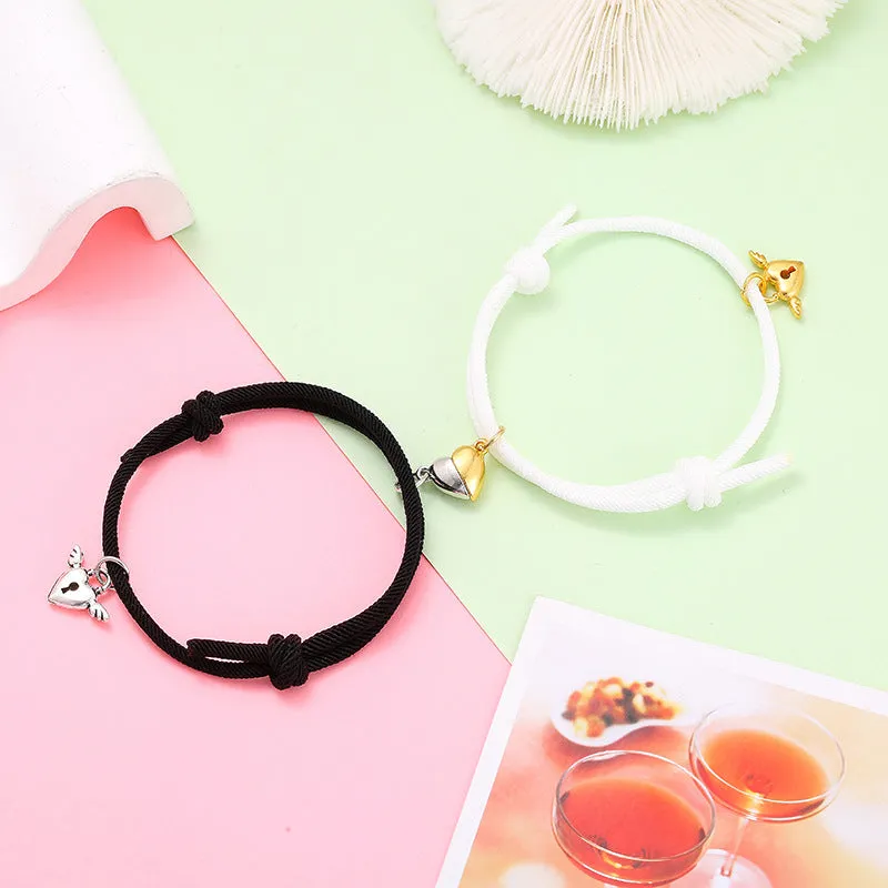 New Love Magnet couple bracelet set, heart-shaped alloy design in black and white, matching pair