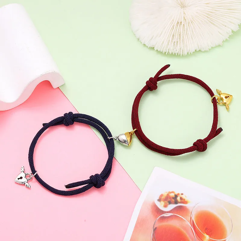 New Love Magnet couple bracelet set, heart-shaped alloy design in black and white, matching pair