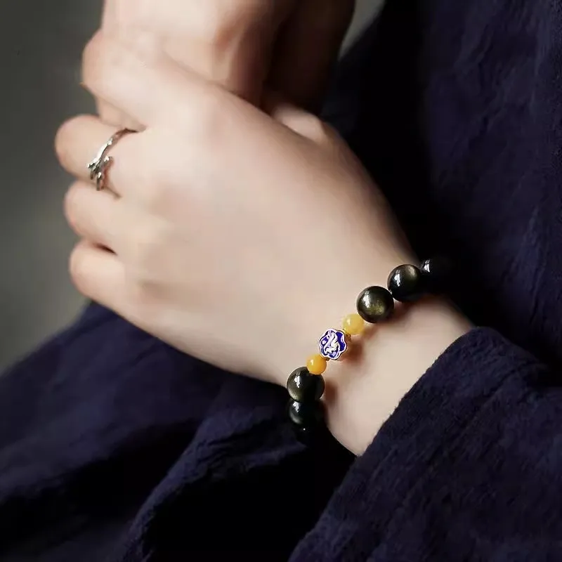 Golden obsidian ethnic bracelet with geometric shape and Chinese zodiac animal charm