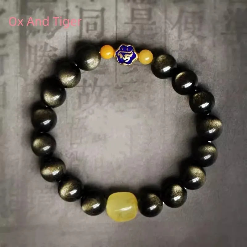 Golden obsidian ethnic bracelet with geometric shape and Chinese zodiac animal charm