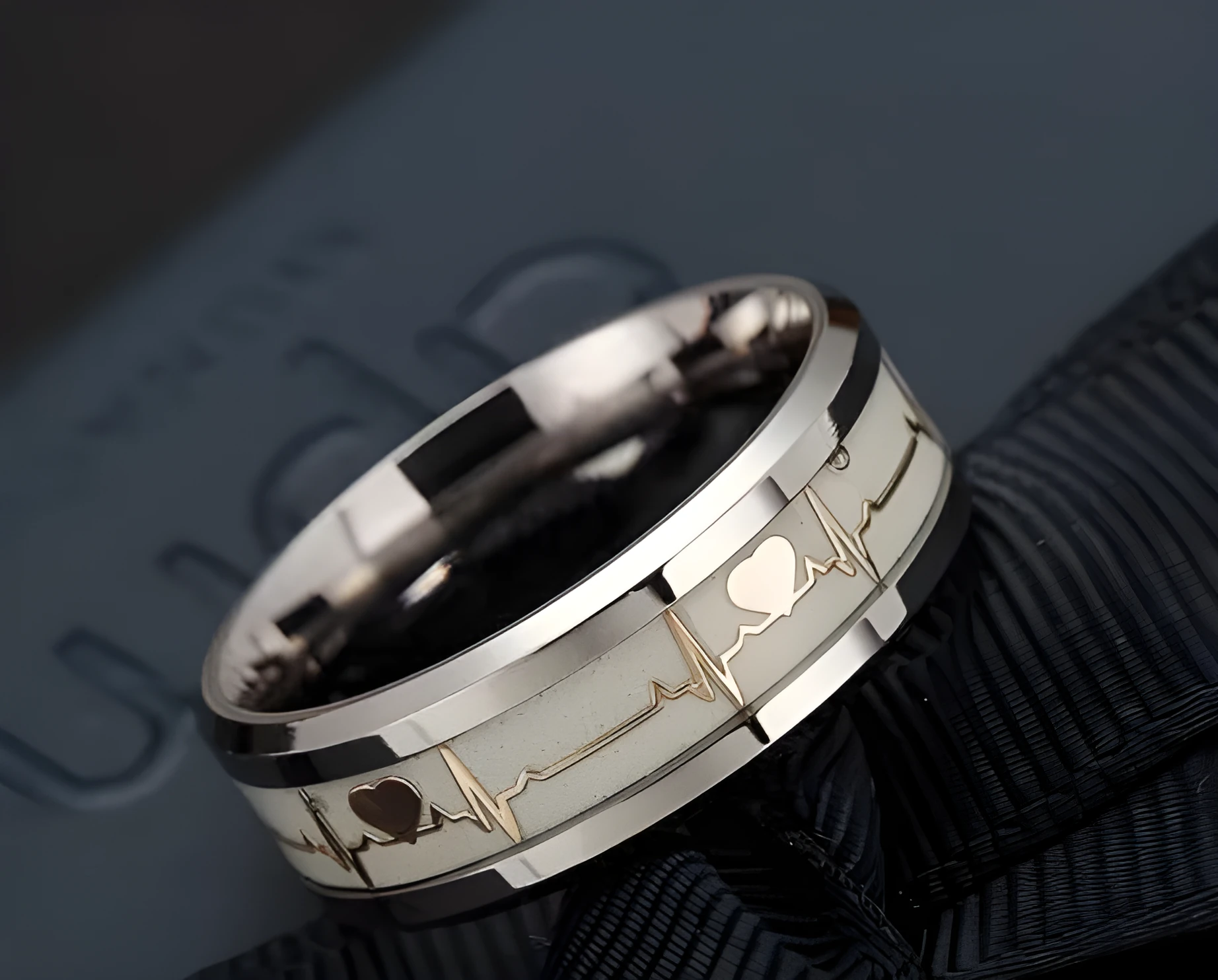 ECG couple carbon fibre ring with luminous glow in heart shape on stainless steel base