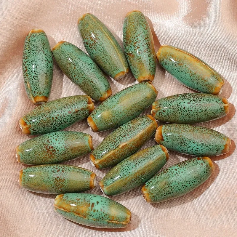 Ceramic bullet beads in seven colours for jewellery making and bracelet braiding