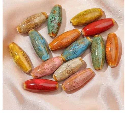 Ceramic bullet beads in seven colours for jewellery making and bracelet braiding