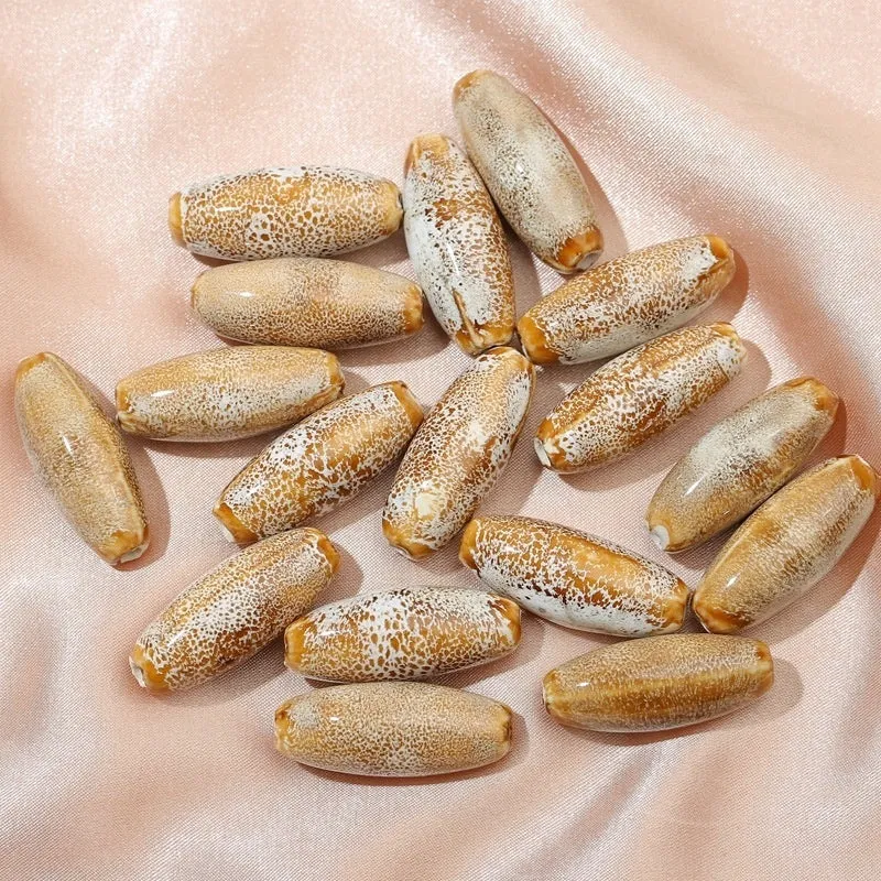 Ceramic bullet beads in seven colours for jewellery making and bracelet braiding