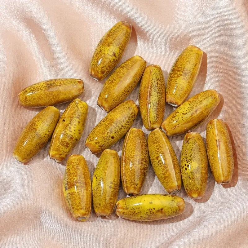 Ceramic bullet beads in seven colours for jewellery making and bracelet braiding