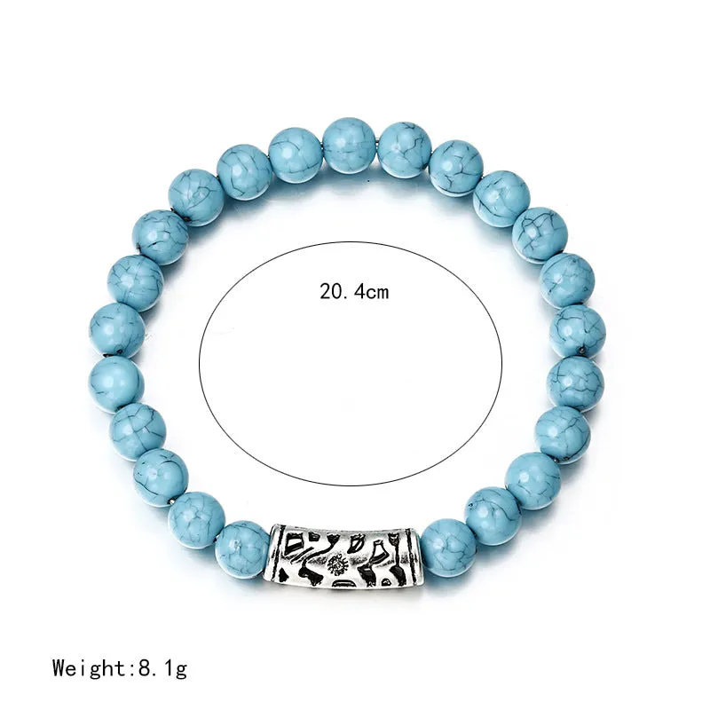 Classic acrylic blue beaded bracelet on wrist showing stretchy cord and smooth round beads
