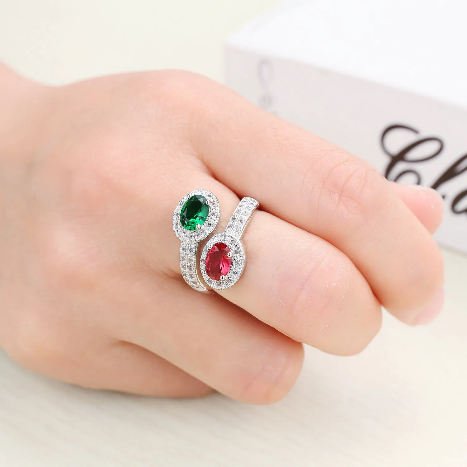 Copper electroplated zircon ring for women in Rose Emerald colour on plain background