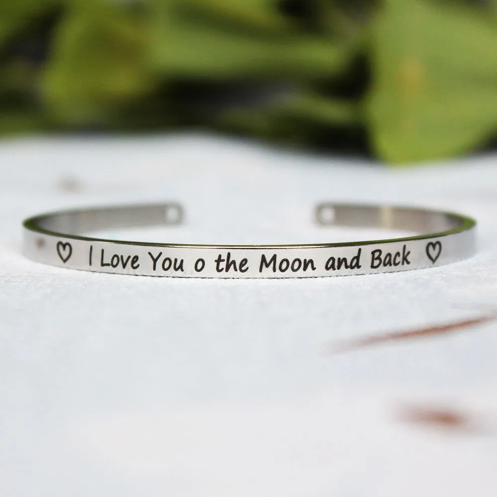 Silver customisable stainless steel bracelet with laser engraved text and adjustable fit on neutral background