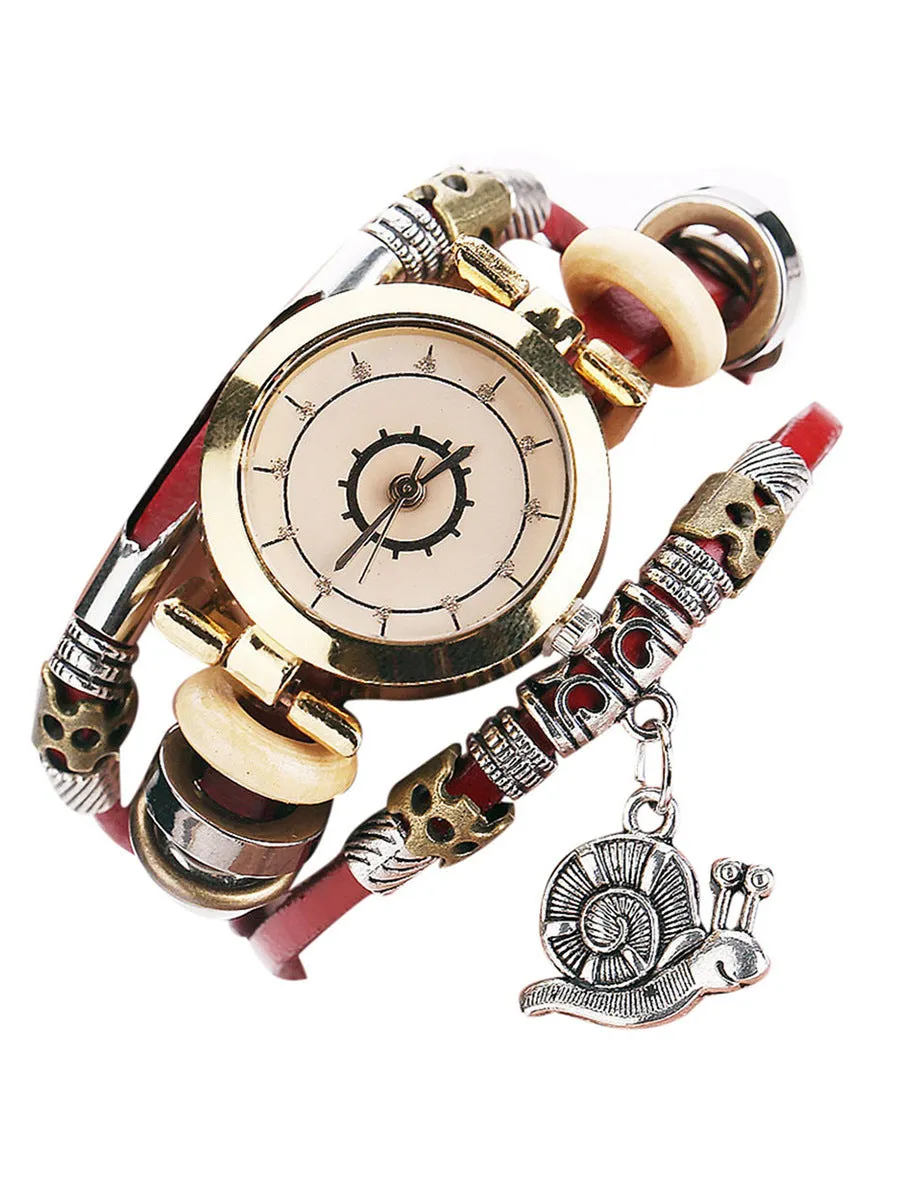 Women's vintage bracelet watch with coiling leather strap and snail pendant in Mori style