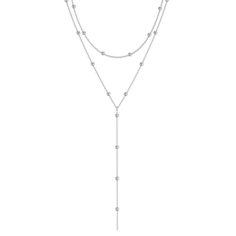 Fashion long necklace with geometric tassel and round beads in gold colour on clavicle chain