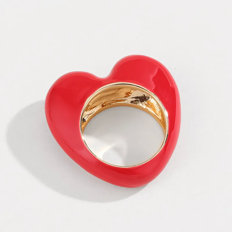 Heart-shaped zinc alloy enamel ring with three-dimensional colour detail in black, pink, purple, or red.