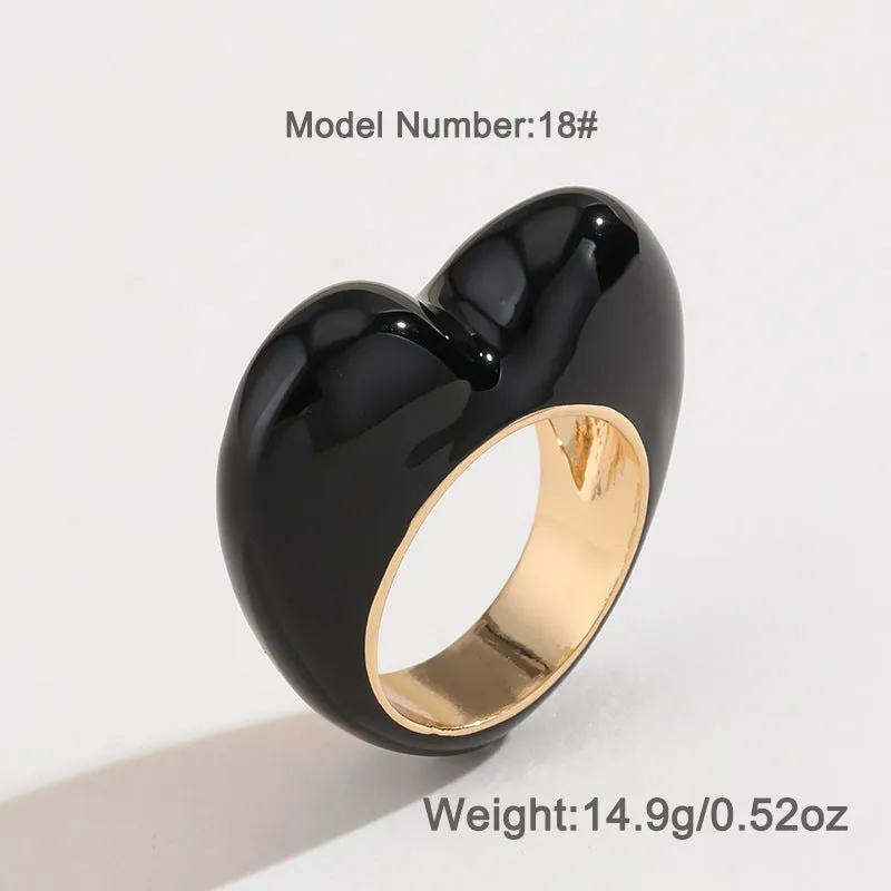 Heart-shaped zinc alloy enamel ring with three-dimensional colour detail in black, pink, purple, or red.