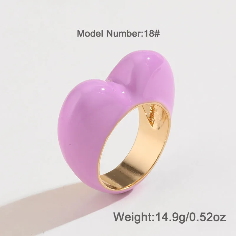 Heart-shaped zinc alloy enamel ring with three-dimensional colour detail in black, pink, purple, or red.