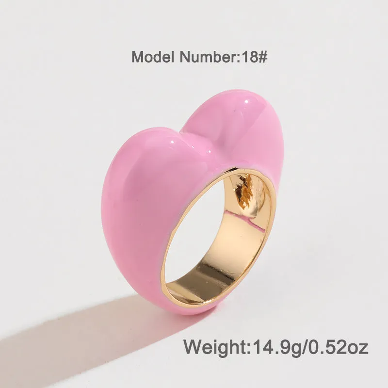 Heart-shaped zinc alloy enamel ring with three-dimensional colour detail in black, pink, purple, or red.