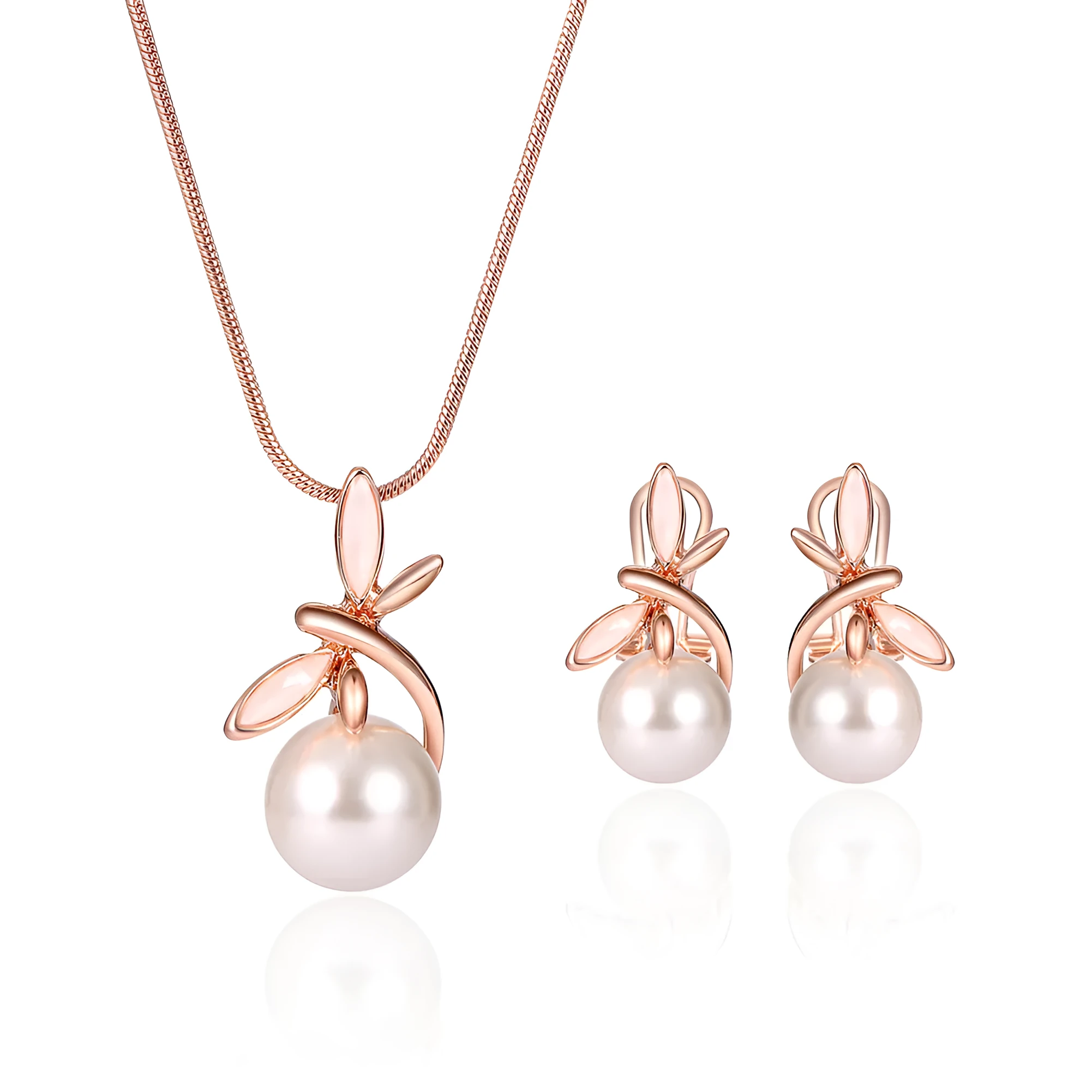Rose gold alloy necklace with artificial gem pendant and matching earrings on a display surface