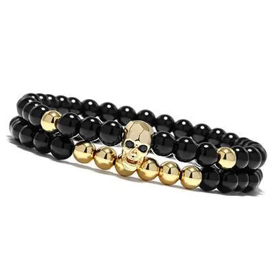 Metal smile skull bracelet in Black finish on a flat surface