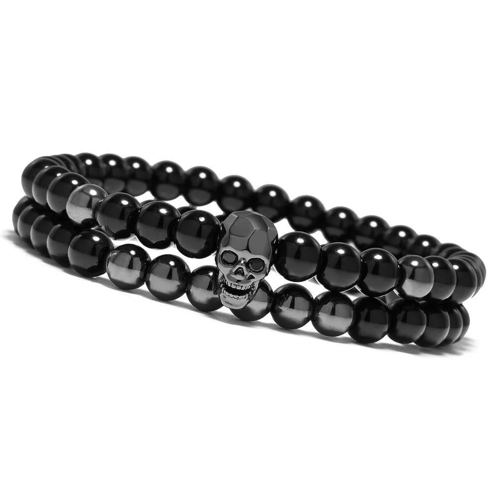 Metal smile skull bracelet in Black finish on a flat surface