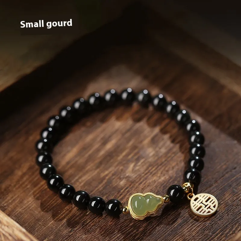 Black obsidian bracelet with a Hetian jade gourd charm in 10mm bead size.