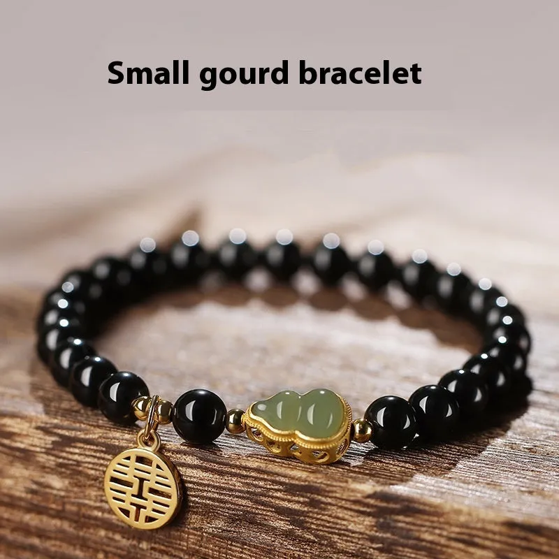 Black obsidian bracelet with a Hetian jade gourd charm in 10mm bead size.