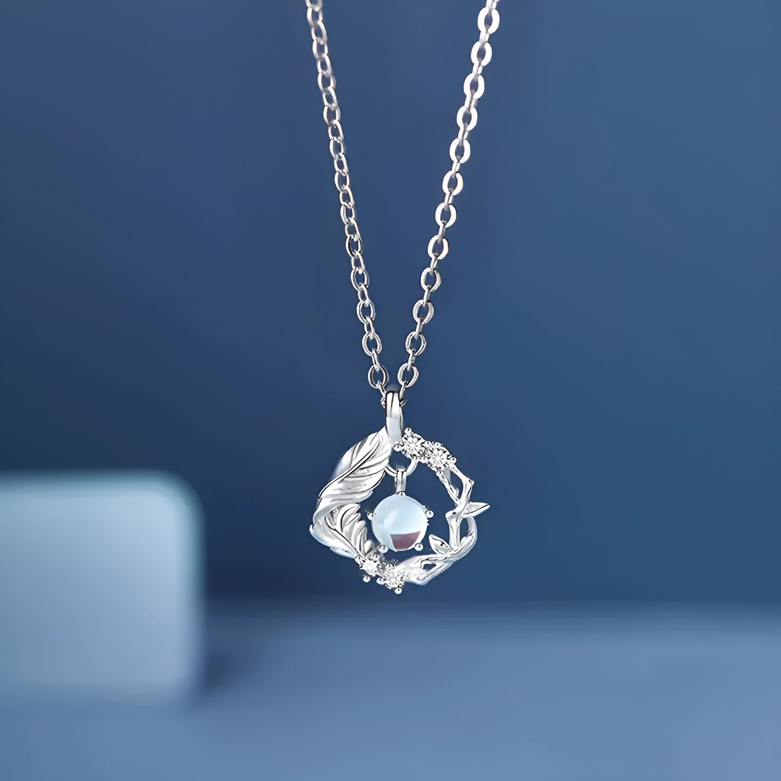 Geometric tree and bluebird pendant necklace on adjustable chain with eucalyptus blue colour option