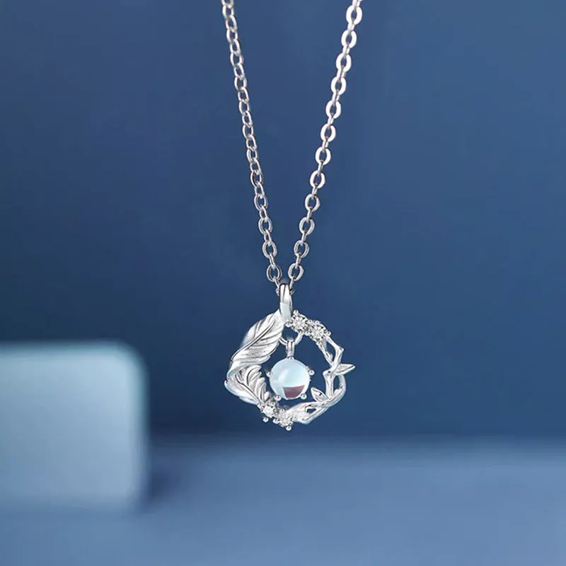 Geometric tree and bluebird pendant necklace on adjustable chain with eucalyptus blue colour option