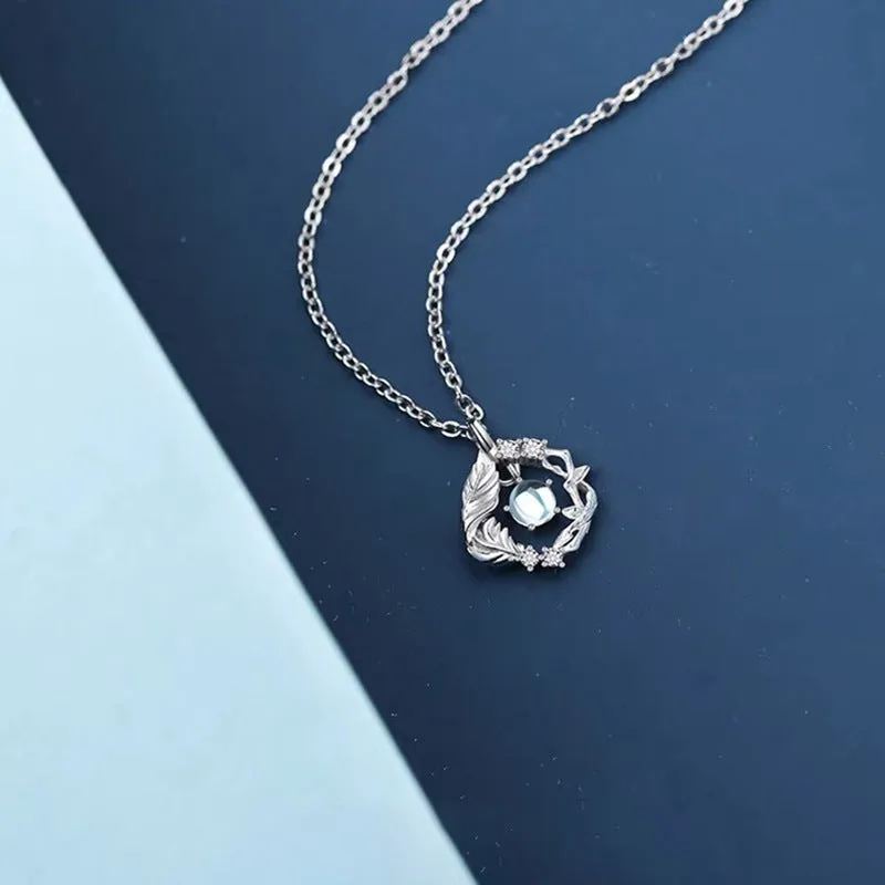 Geometric tree and bluebird pendant necklace on adjustable chain with eucalyptus blue colour option
