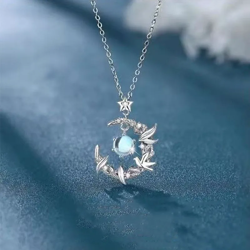 Geometric tree and bluebird pendant necklace on adjustable chain with eucalyptus blue colour option