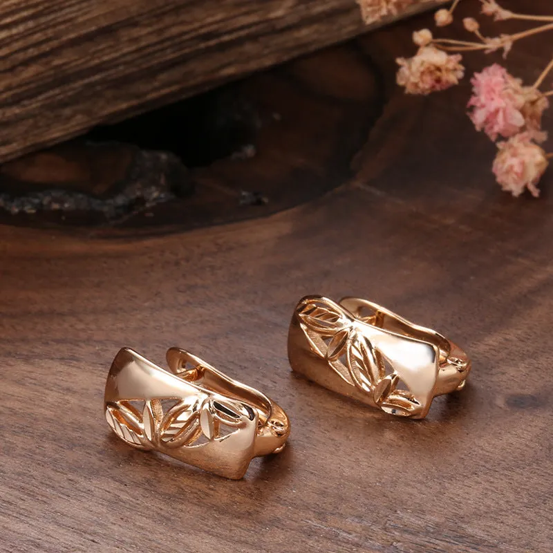 Hollow-carved floral copper earrings with smooth surface and U-shaped design in H0147 colour