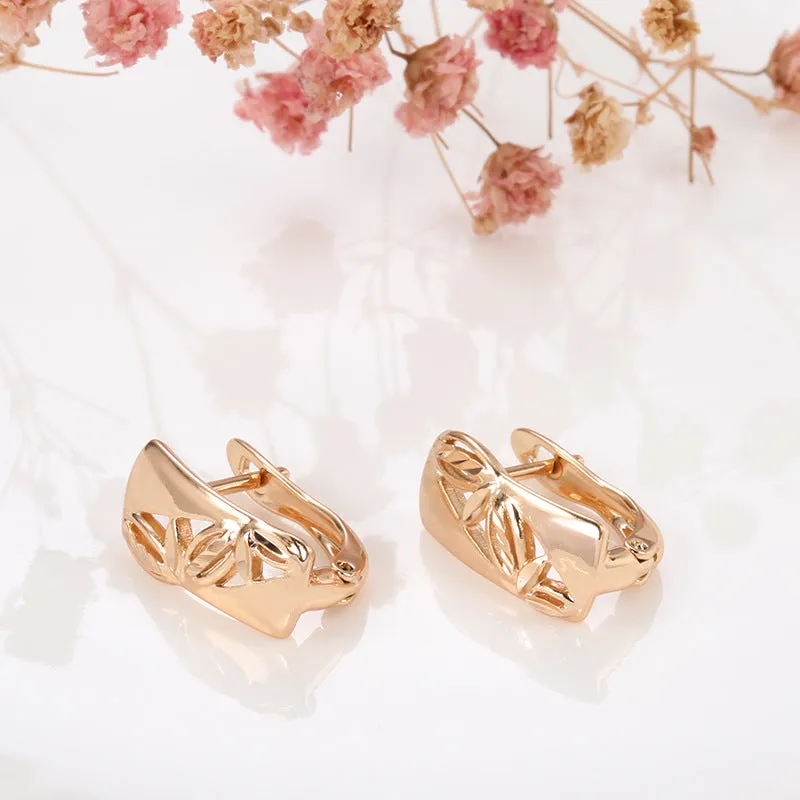 Hollow-carved floral copper earrings with smooth surface and U-shaped design in H0147 colour
