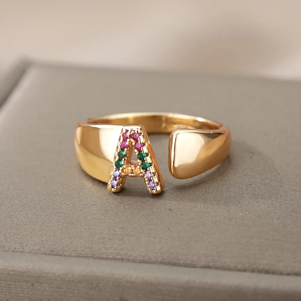 Fashion micro-set colored zirconium adjustable open ring showing letter A on a copper electroplated base