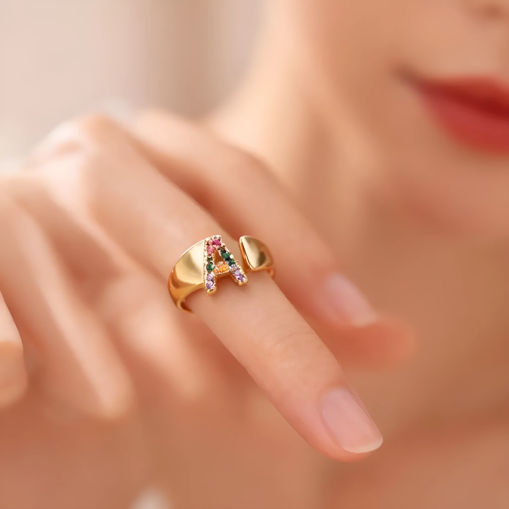 Fashion micro-set colored zirconium adjustable open ring showing letter A on a copper electroplated base