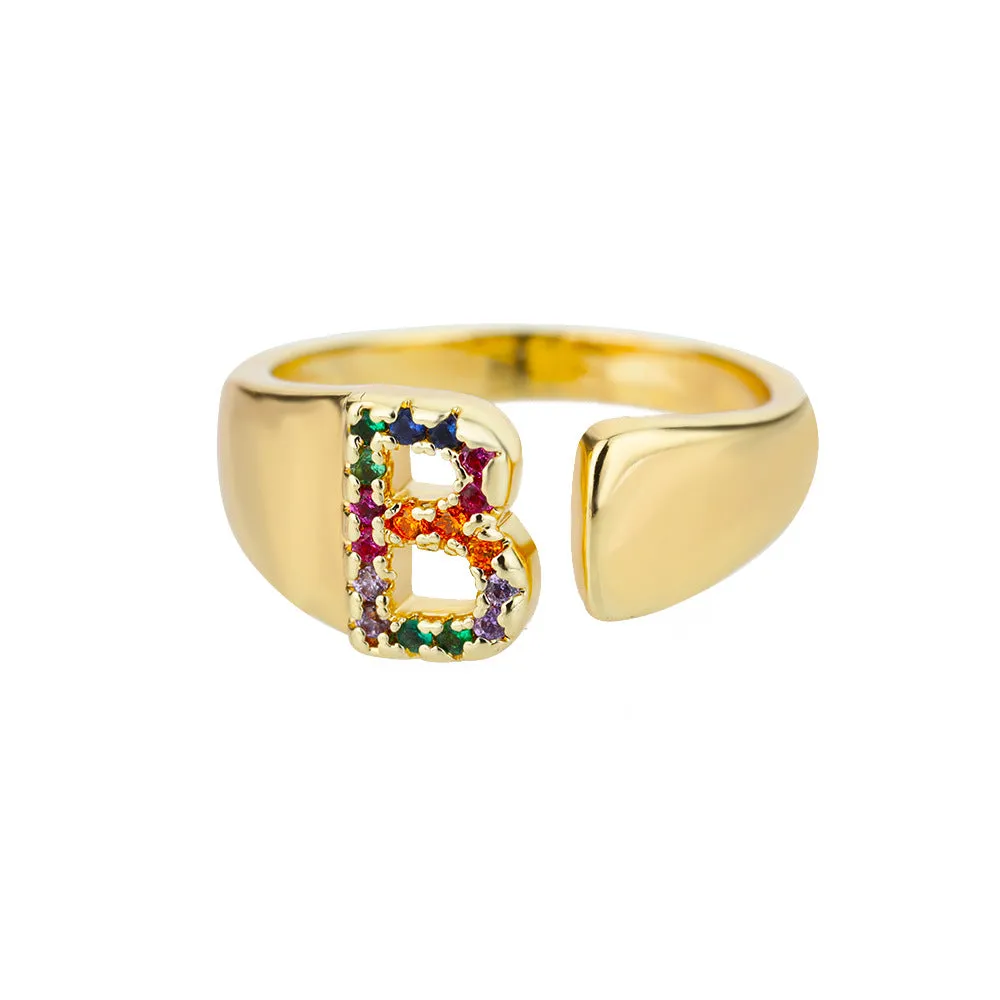 Fashion micro-set colored zirconium adjustable open ring showing letter A on a copper electroplated base