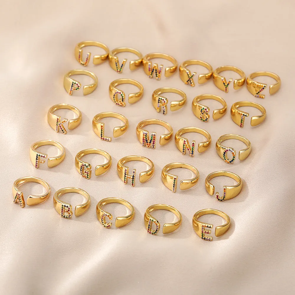 Fashion micro-set colored zirconium adjustable open ring showing letter A on a copper electroplated base