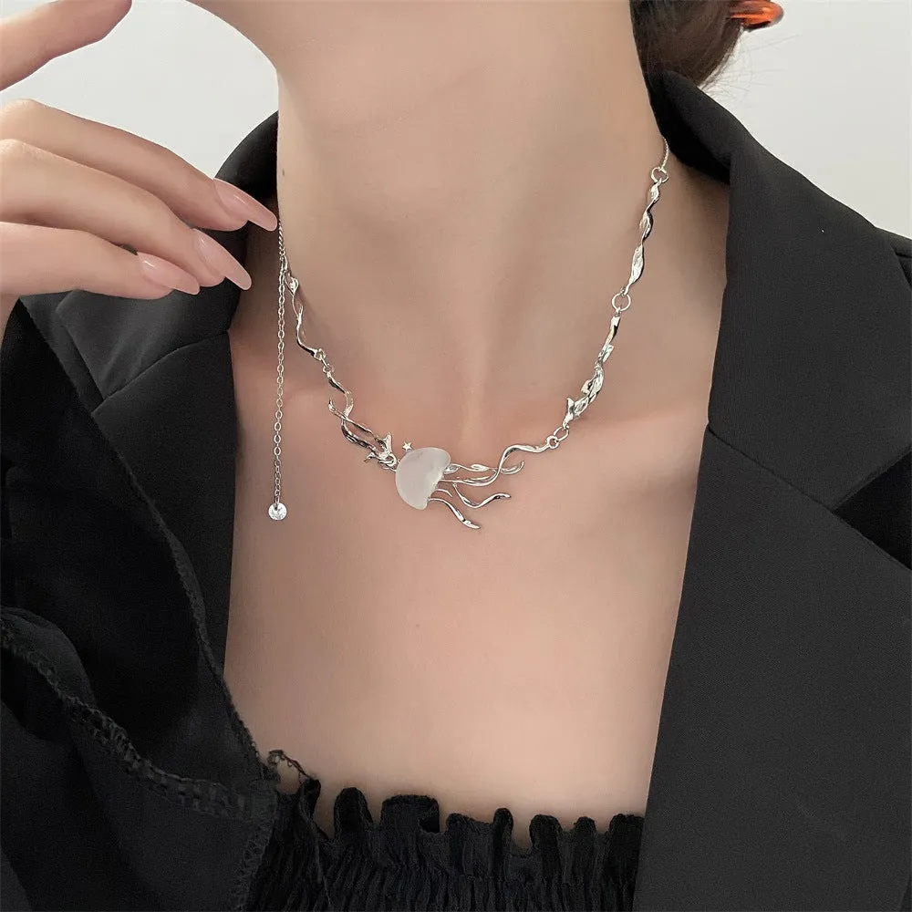 Alloy jellyfish tassel necklace and earring set in electroplated white finish on display