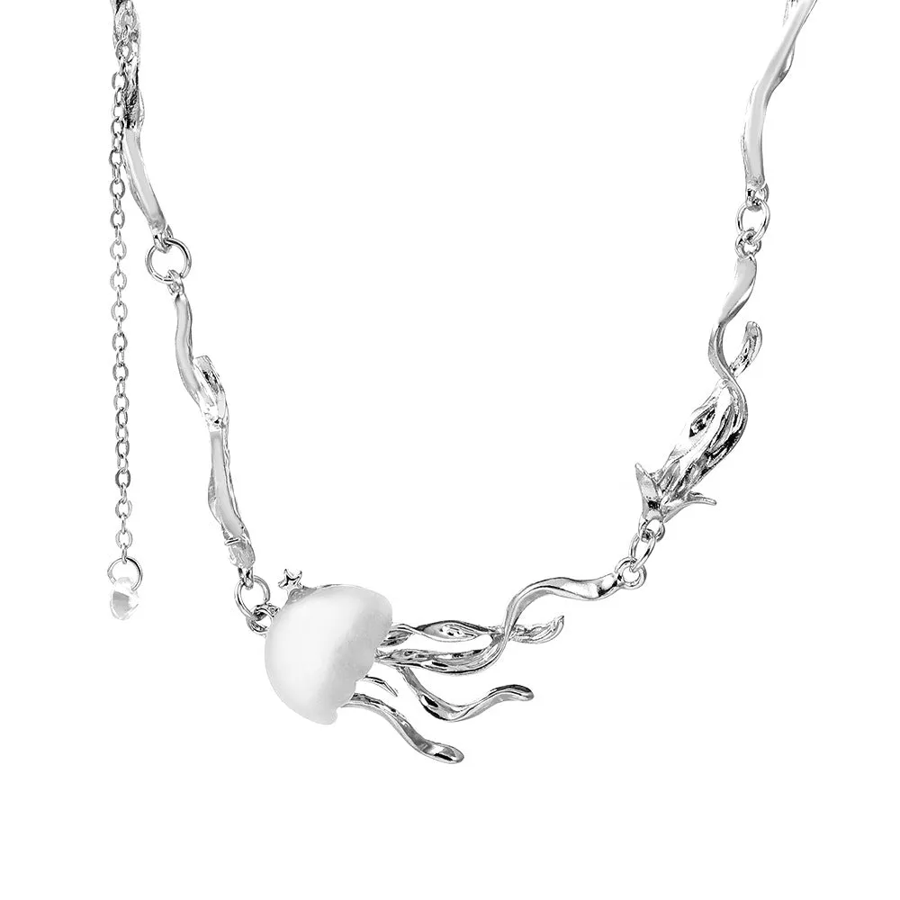 Alloy jellyfish tassel necklace and earring set in electroplated white finish on display