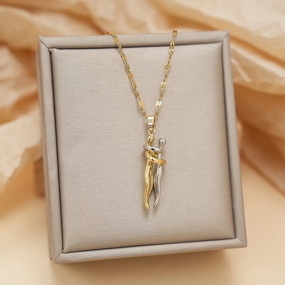 Couple hugging bronze pendant necklace on unisex stainless steel chain with gold lip chain finish, casual style