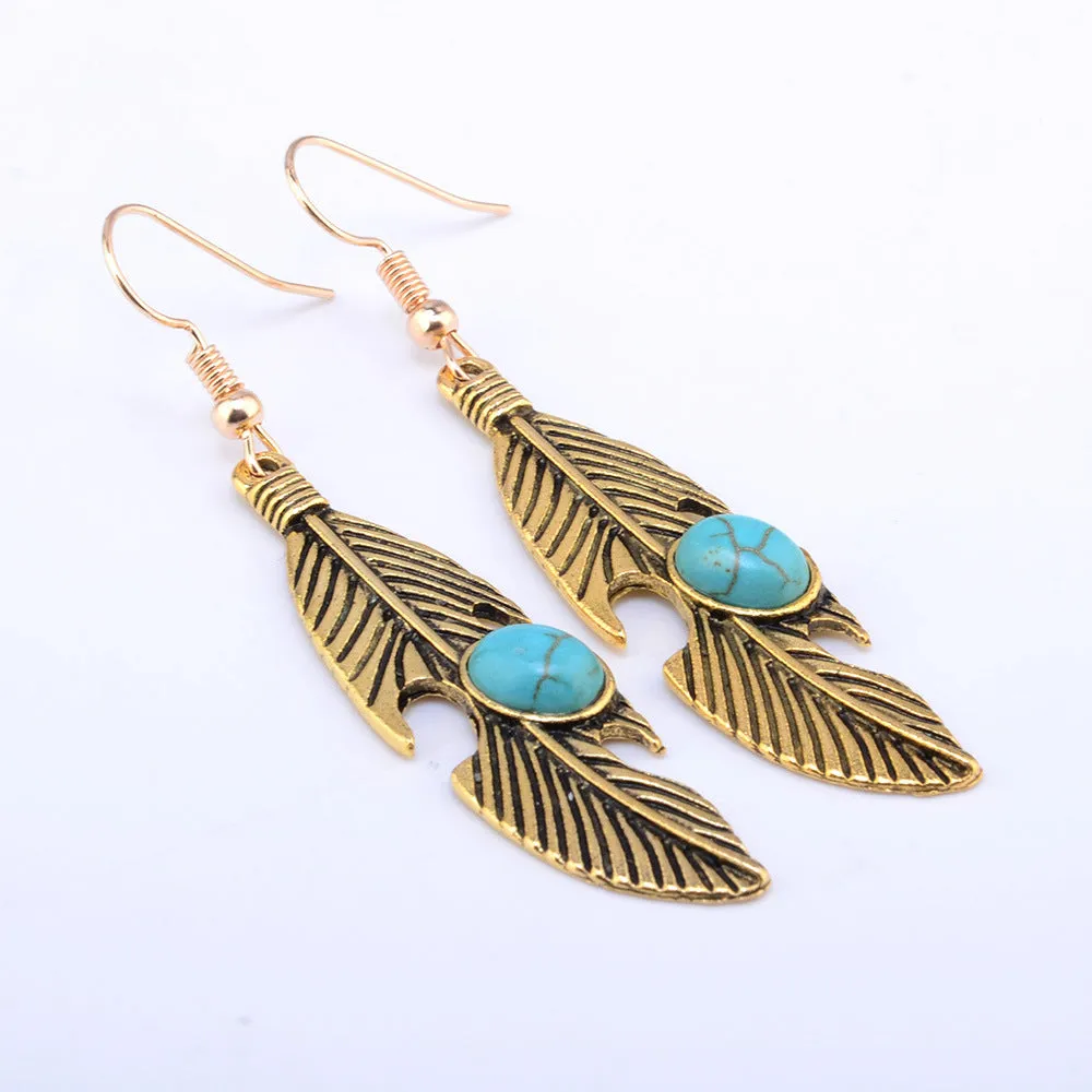 Vintage feather earrings with turquoise inlay leaf pattern in antique gold